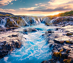 Spectacular summer view of Bruarfoss Waterfall, secluded spot with cascading blue waters. Superb sunrise in Iceland, Europe.