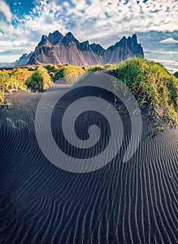 Spectacular summer view of Stokksnes cape with Vestrahorn Batman Mountain on background.