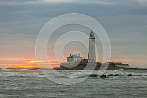 A spectacular sunrise at St Mary`s Lighthouse in Whitley Bay, as the sky erupts in colour