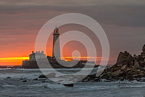 A spectacular sunrise at St Mary`s Lighthouse in Whitley Bay, as the sky erupts in colour