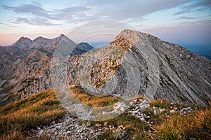 Spectacular sunrise with sun illuminated mountain views.