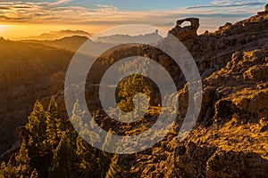 Spectacular sunset over roque nublo mountain on Gran Canaria, in