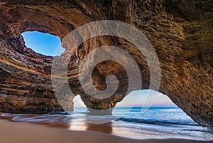 Spectacular sunset view of the Benagil Sea Cave in Algarve, Portugal, Europe