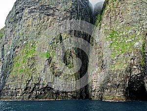 Spectacular Vestmanna high cliffs in Faroe Islands photo