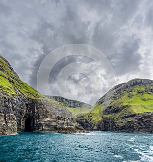 Spectacular Vestmanna steep cliffs in Faroe Islands photo