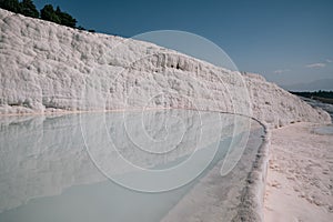 spectacular view of famous white rocks reflected in water of pool,