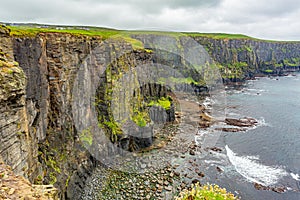 Spectacular view of the rocky cliffs along the coastal walk route from Doolin to the Cliffs of Moher