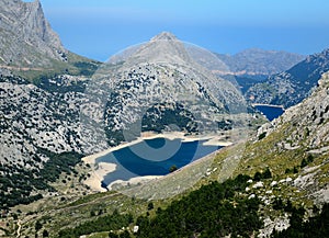 Spectacular View From The Summit Of Mount L`Ofre To The Puig Major And The Marine Blue Lake Cuber In The Tramuntana Mountains On