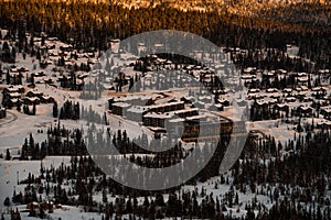 Spectacular view from top of the mountain. Forest and wooden houses.