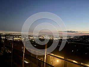 Spectacular view from the top of a mountain, of the sunset of a city