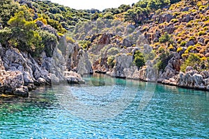 Spectacular view of the turquoise Mediterranean Sea and the rocky coast of Kekova\'s Yaglica Bay.