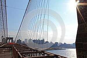 Spectacular views of the Brooklyn Bridge with all its characteristic metal wires and the pedestrian walkway
