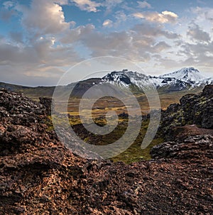Spectacular volcanic view from Saxholl Crater, Snaefellsnes peninsula, West Iceland. Snaefellsjokull snowy volcano top in far