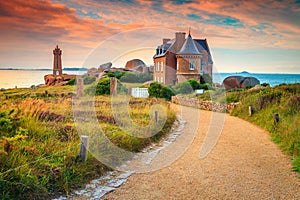 Spectacular walkway and lighthouse in Brittany region, Ploumanach, France, Europe