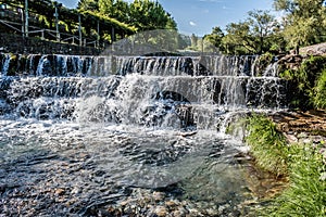 Spectacular waterfall on steps at the PoÃÂ§o de Corga River beach, Castanheira de PÃÂªra PORTUGAL photo