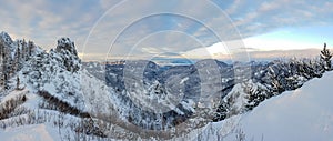 Spectacular winter mountain landscape illuminated by setting sun.