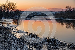 A spectacular winter sunset landscape in the Russian countryside with waterfront. Surroundings of Taganrog., Mius river