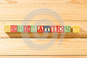 Spectacular wooden cubes with the word GENERATION Y on a wooden surface