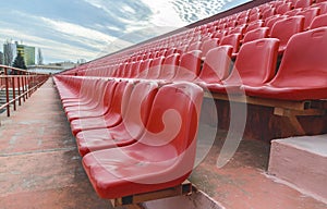 Spectator bleachers on an open soccer field. Stadium for summer football matches. Outdoor stadium