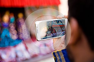 Spectator filming Kathputli