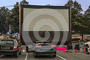 Spectators for car parking with cars, an inflatable screen of th