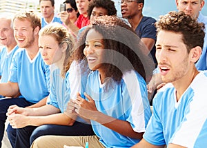 Spectators In Team Colors Watching Sports Event