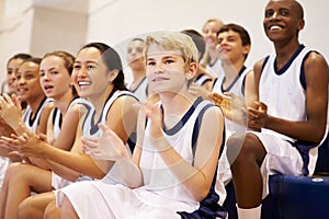 Spectators Watching High School Basketball Team Match