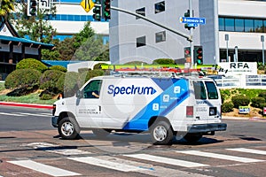 Spectrum Phone, Cable TV, and Internet telecommunications service van is driving to performing a service call
