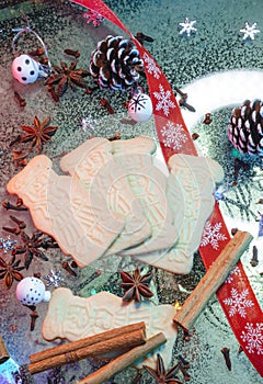 Speculaas biscuits on the table with christmas decoration and spices