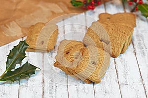 `Speculaas` or `speculoos`, a spiced thin, crunchy and caramelizedand shortcrust biscuit with figure stamped on the front side