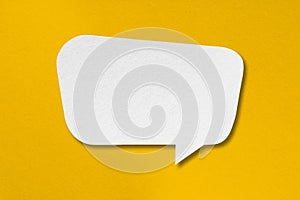 Speech balloon shape white paper isolated on yellow background