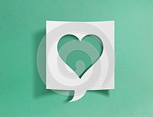 Speech bubble with hearth symbol