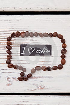 Speech bubble made from coffee beans with I love coffee message.