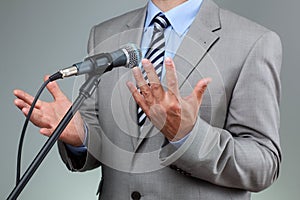 Speech with microphone and hand gesture