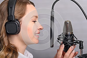 Speech recording on radio stations, the announcer works in the studio with a studio microphone