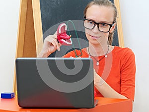 Speech Therapist conducts an online lesson with a laptop