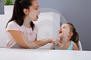 Speech Therapist Helps The Girl How To Pronounce The Sounds