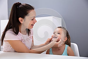 Speech Therapist Helps The Girl To Pronounce The Sounds