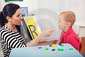 Speech therapist teaches the boys to say the letter R