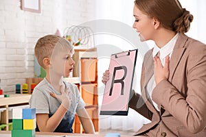 Speech therapist working with little boy