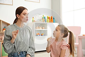 Speech therapist working with little girl