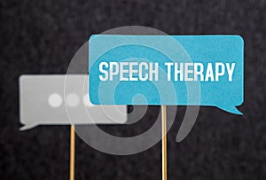 Speech therapy text on cardboard speech balloon or bubble