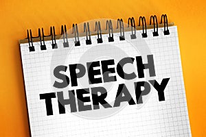 Speech Therapy - training to help people with speech and language problems to speak more clearly, text concept on notepad