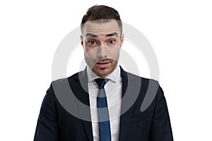 Speechless businessman looking forward while standing