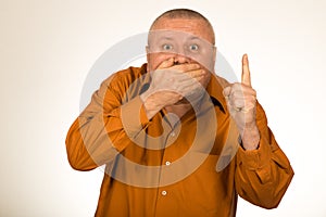 Speechless man showing finger