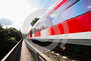 Speed blurred passenger train outdoors
