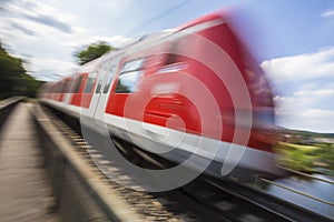 Speed blurred passenger train outdoors