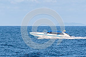 Speed boat blue sky