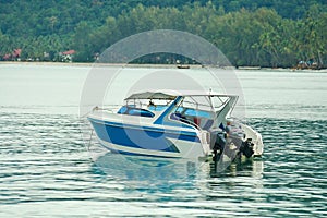 Speed boat on blue water