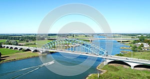 Speed Boat Crossing the IJssel Bridge, Dynamic Shot - Zwolle, The Netherlands, 4K Drone Footage